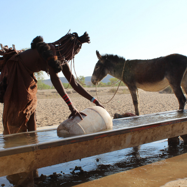 Keriorere and Dendu collect water at Namibia waterpoint