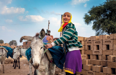 Brick kiln worker and donkey